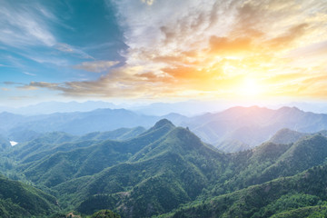 Green mountain and colorful cloud at sunset