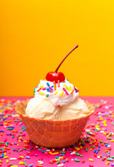 Vanilla Ice Cream in a Waffle Cone Bowl wiht a Cherry on Top