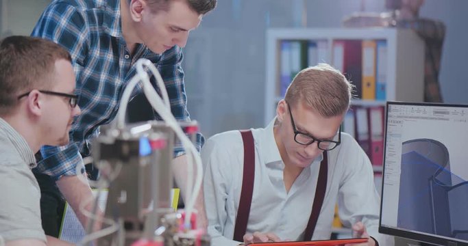 Young students of robotics preparing their invention