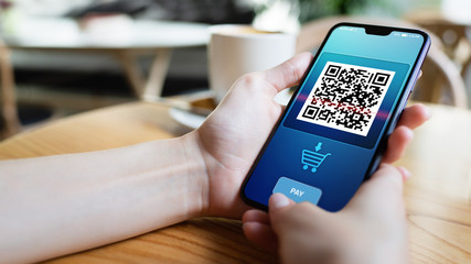 QR code mobile phone scan on screen. Business and technology concept.