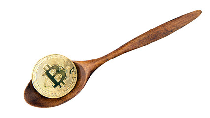 bitcoin on brown wooden spoon isolated on white background. cryptocurrency blockchain concept