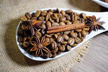 Aromatic coffee in beans and spices and chocolate
