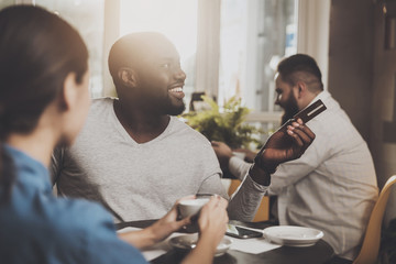 Young African American is calculated credit card