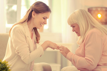 Happy good looking woman showing her hand