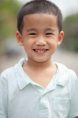 toothy smiling face of asian children happiness emotion face