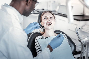 Kind female person keeping her mouth opened