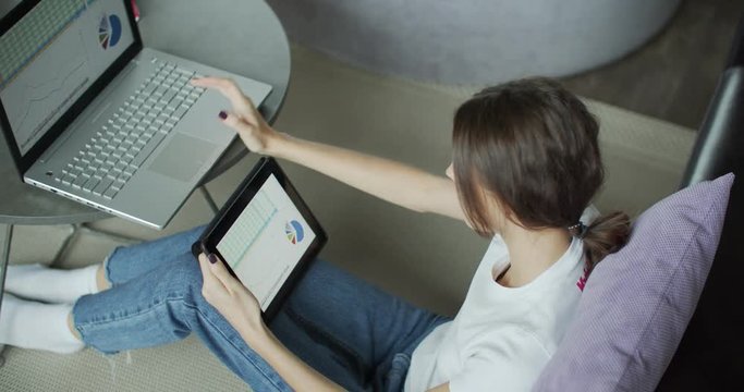 Young woman using digital tablet computer in home