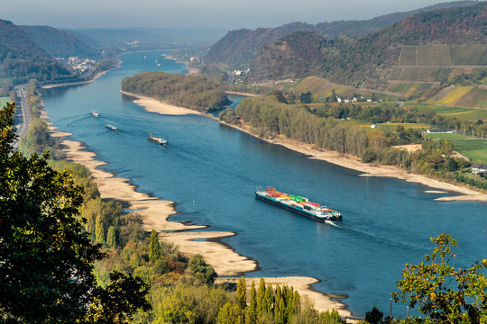 Drought in Germany, low water of the Rhine river in andernach near koblenz influending water transport freight ships