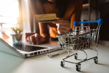  Cart Online Shopping concept. businesswoman hand using smart phone, tablet payments and holding credit card online shopping, omni channel, computer virtual icons 