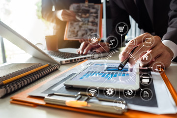 Working team meeting concept, business using laptop and smart phone and digital tablet computer with digital marketing media  in virtual icon network diagram office in morning light