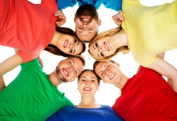 Large group of smiling friends staying together and looking at camera isolated on white background.