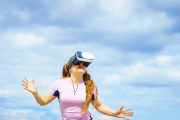 Woman wearing VR outside