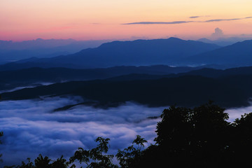  sunset overlooking mountains with Mist