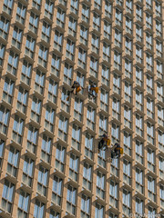 Window cleaners outside an office buildings