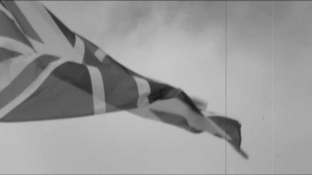 Flag of The United Kingdom (UK) waving against a sky | 4K - VINTAGE STYLE - BLACK AND WHITE - PROJECTOR - SLOW MOTION - SLOMO