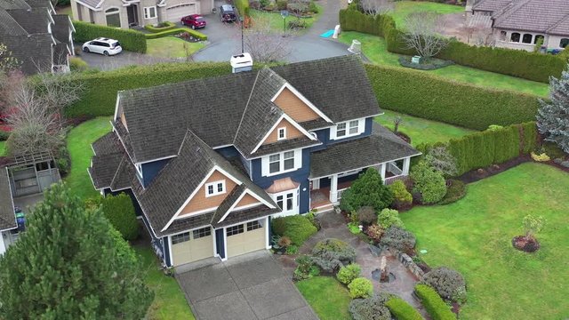 A perfect neighbourhood. Houses in suburb at Summer in the north America. Luxury houses with nice landscape. Aerial drone view.