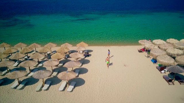 Beautiful Beach With Family Top Aerial View Drone Shot, Sithonia, Greece