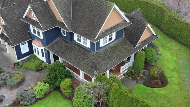 A perfect neighbourhood. Houses in suburb at Summer in the north America. Luxury houses with nice landscape. Aerial drone view.