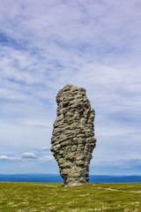 The stone shaman on the plateau Manpupuner is a majestic and mysterious stone idol.