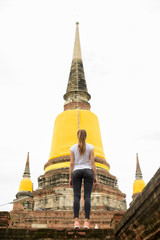 Fototapeta na wymiar Young beautiful tourist woman having vacation in Ayutthaya, Thai