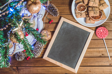 Christmas tree, toys and gifts with a clean slate for text top view