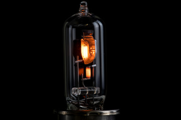 Incandescent lamp for dipped and main beam headlights with burning spiral on a black background