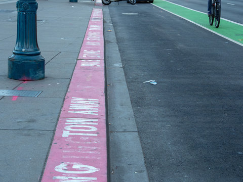 Tow Away Bus Zone Red Painted Curb In City