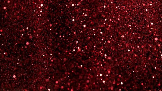 Red glitter explosion in super slow motion shooted with high speed cinema camera at 1000fps 4K.