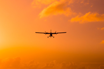 Fototapeta na wymiar Silhouette of an airplane at sunset.