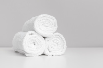 Fototapeta na wymiar Clean soft towels on color background