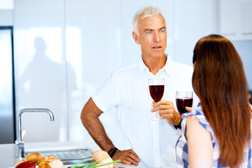 Portrait of a couple having a glass of red wine