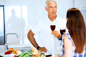 Portrait of a couple having a glass of red wine