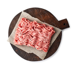 Raw minced pork meat on wooden board isolated on white background.