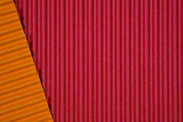 Red and orange corrugated paper texture, use for background. vivid colour with empty space for add text or object.