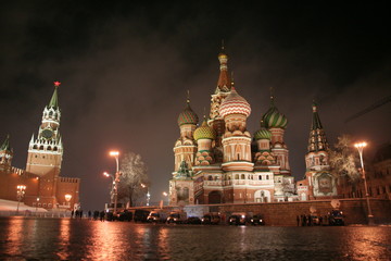 Red square in november night lights, first snow, fog, wet stones, Kremlin tower and St.Basil Cathedral