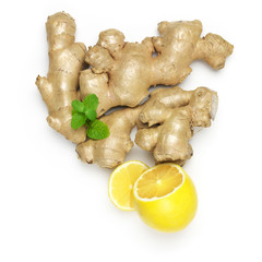 Ginger roots with lemon and mint leaves