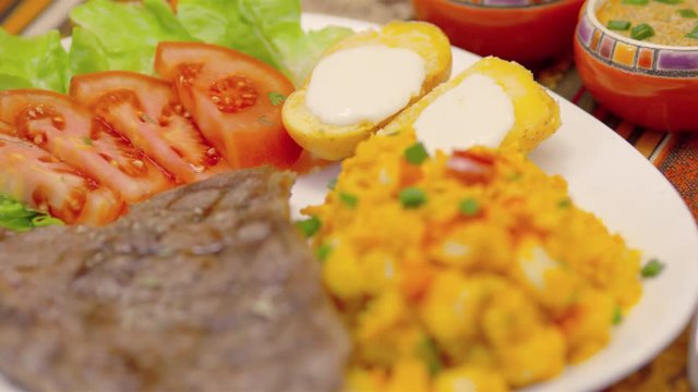 Meat Steak with corn tomatoes, lettuce and potatoes