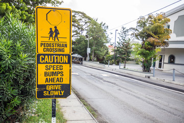 Black and yellow children crossing ahead sign