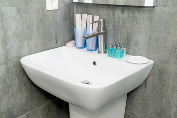 The photo of a sink in a bathroomThe photo of a sink in a bathroom