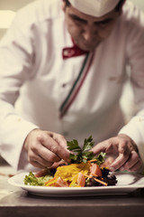chef serving vegetable salad
