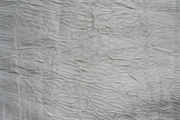 white crumpled silk fabric. Background.