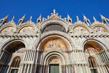 San Marco basilica facade with mosaics in Venice, clear blue sky in a sunny day in Italy