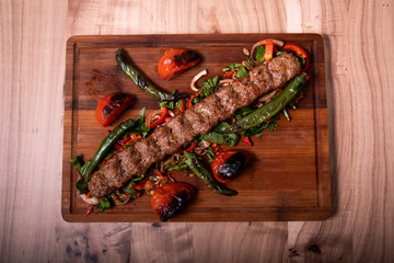 Traditional Turkish Adana Kebab on Wooden Plate