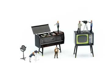 Miniature people : the small team of tv reporter of Audio Speakers, production television concept.