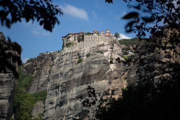 Fototapeta premium Mountain scenery with Meteora rocks and Roussanou Monastery, landscape place of monasteries on the rock.