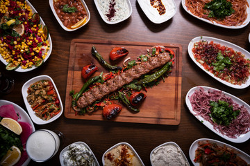 Traditional Turkish Adana Kebab Set on Wooden Table.