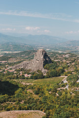 Fototapeta na wymiar Mountain scenery with Meteora rocks and Roussanou Monastery, landscape place of monasteries on the rock.