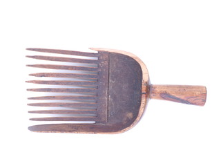 wooden rake on white background