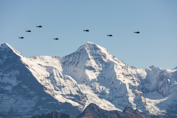 The Swiss Air Force flies with its helicopters a display between the Jungfraujoch and the mountain Jungfrau above the Alps in the Bernese Oberland in Switzerland © Fredy Thürig