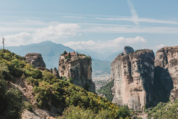 Mountain scenery with Meteora rocks and Roussanou Monastery, landscape place of monasteries on the rock.